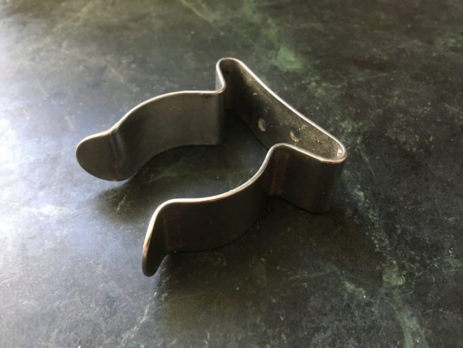 Stainless steel spring clamp on a counter